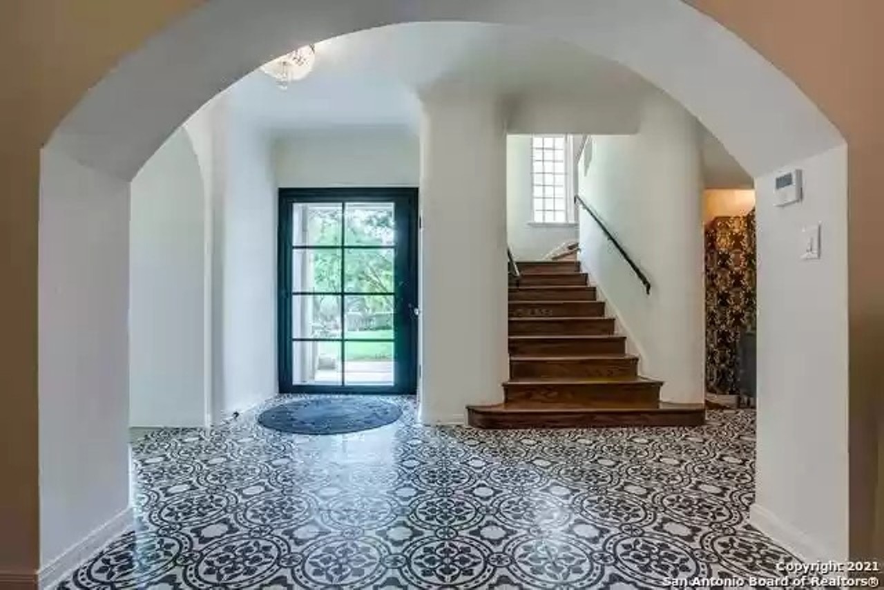 A 1929 rock house for sale in Olmos Park has gorgeous tile work and an amazing outdoor kitchen