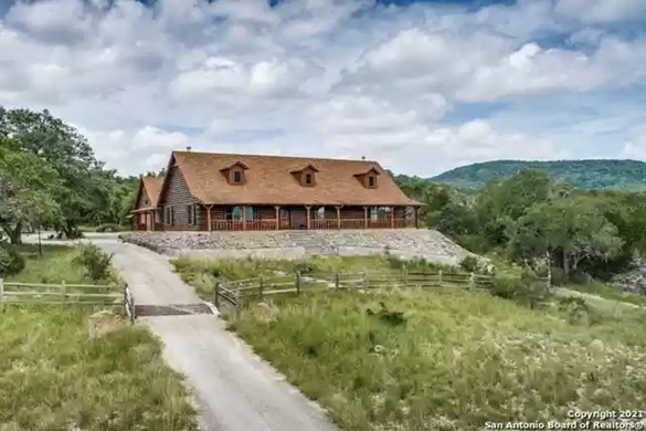 A 4,000-square-foot log cabin full of high-end woodwork is for sale northwest of San Antonio