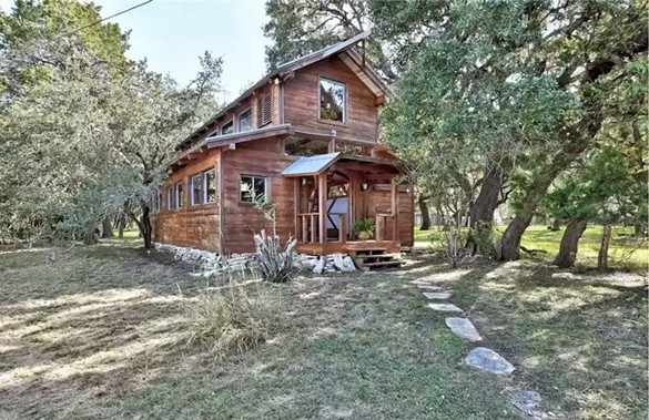 A giant cabin for sale north of San Antonio is made out of reclaimed 19th century wood
