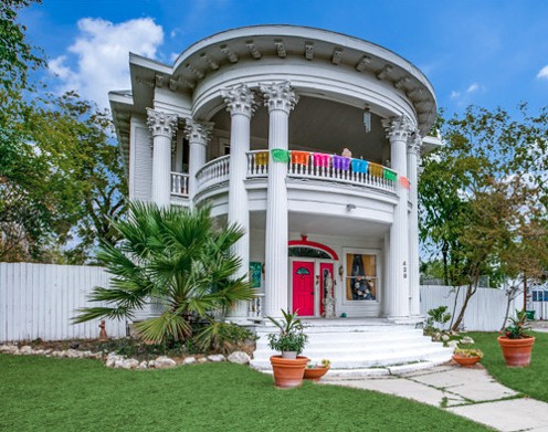 A historic San Antonio home with dual rounded porches and giant columns is now for sale