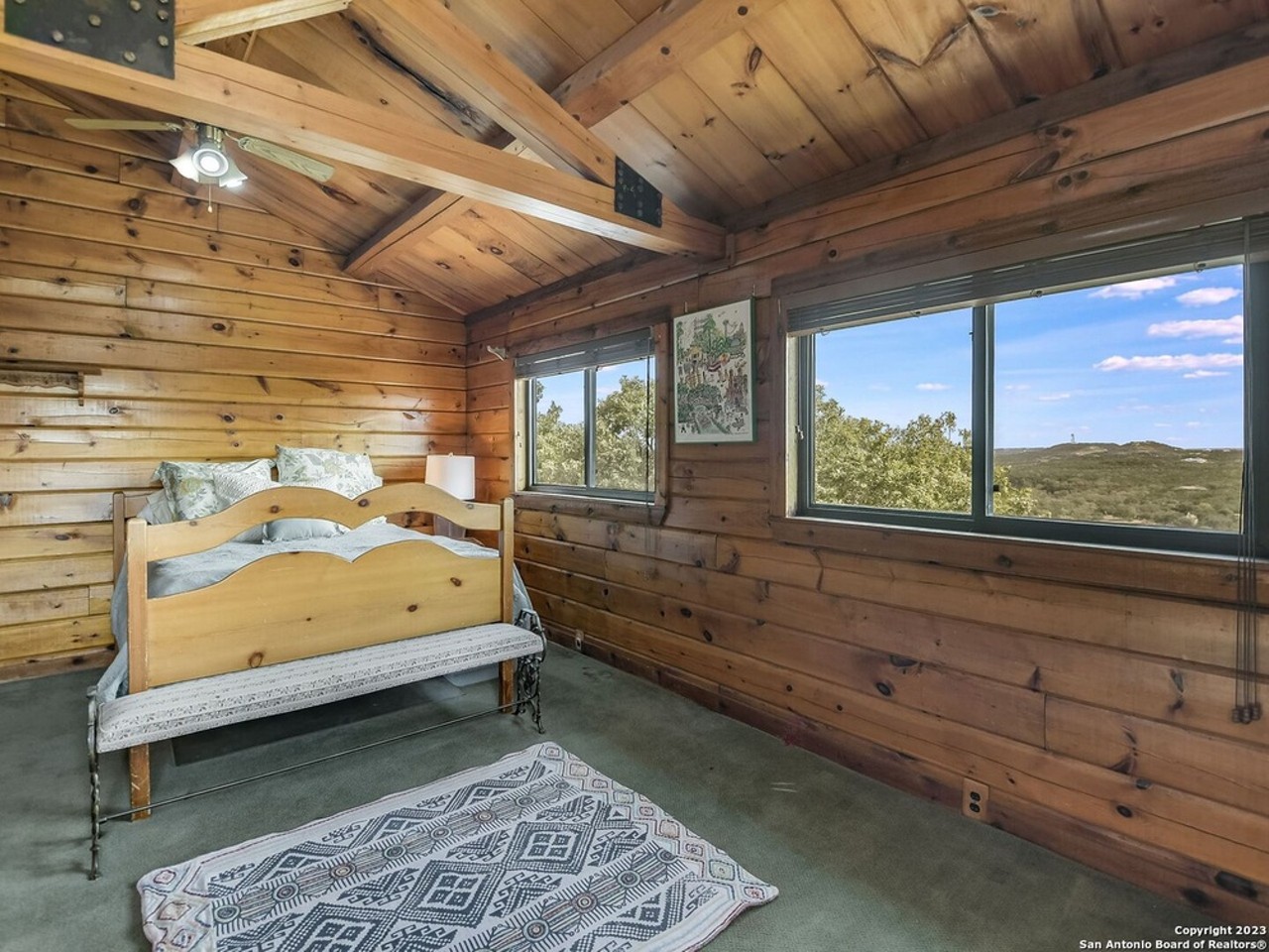 A log cabin compound for sale in San Antonio is built on the county's