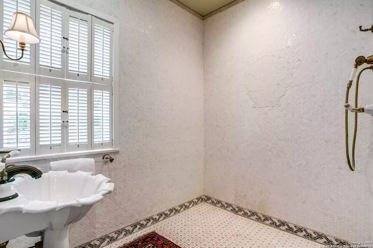 A retired AT&T exec is selling his $3.8 million Olmos Park estate with an Olympic-sized pool