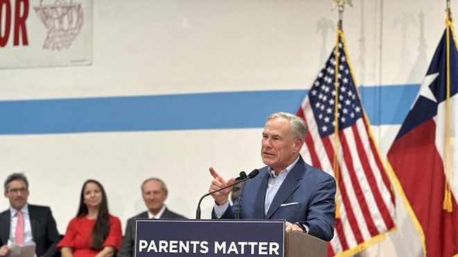 Gov. Greg Abbott wags his finger during a pro-school choice rally in San Antonio last year.
