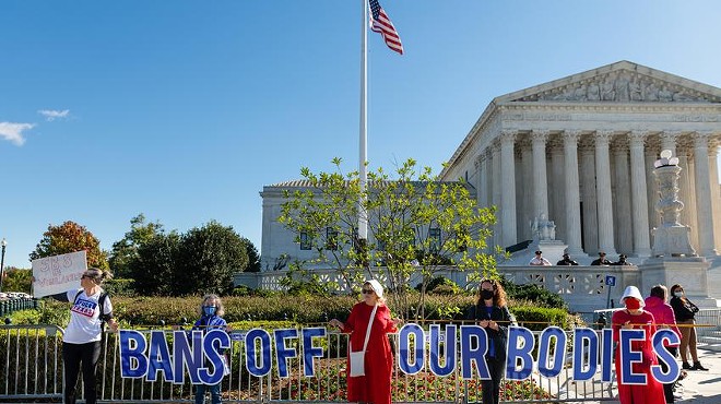 Protesters hold signs reading, “Bans off our bodies,” outside the Supreme Court in Washington, D.C.