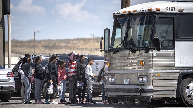 People who were apprehended by state troopers after crossing the border were brought to the International Bridge in Eagle Pass, where they were handed over to Border Patrol custody on Thursday, May 28, 2022.