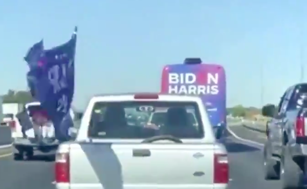 The trucks of Trump supporters swarm a Biden-Harris campaign bus during an incident on I-35 four years ago.