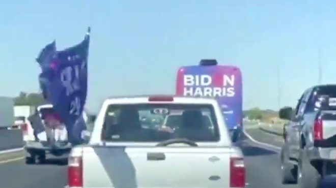 The trucks of Trump supporters swarm a Biden-Harris campaign bus during an incident on I-35 four years ago.