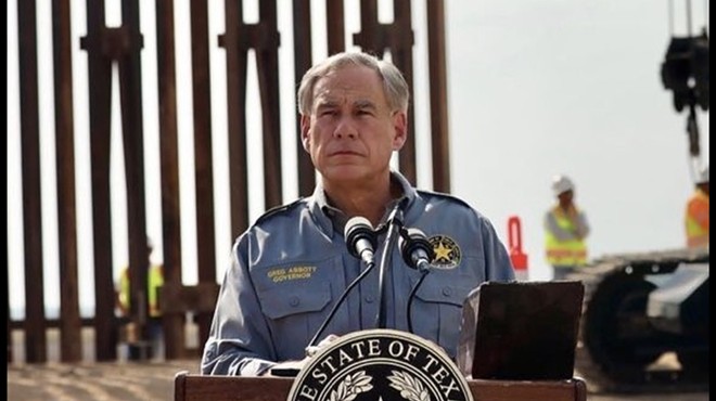 Gov. Greg Abbott puts on a scowl and a faux-military shirt for a photo op along the U.S.-Mexico border.