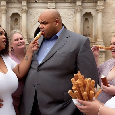 Charles Barkley bites into a churro in front of the Alamo.