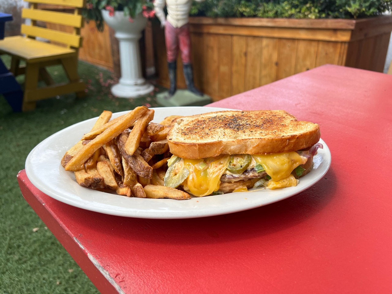 Bombay Bicycle Club
3506 N St Mary's St
Bombetter Patty Melt
Toasty oregano sourdough, 100% Angus Beef patty,  sweet red onion, green onion, chipotle mayo, pickled jalapeno, Swiss, cheddar, jack & American cheese. Or add toppings for the ultimate!