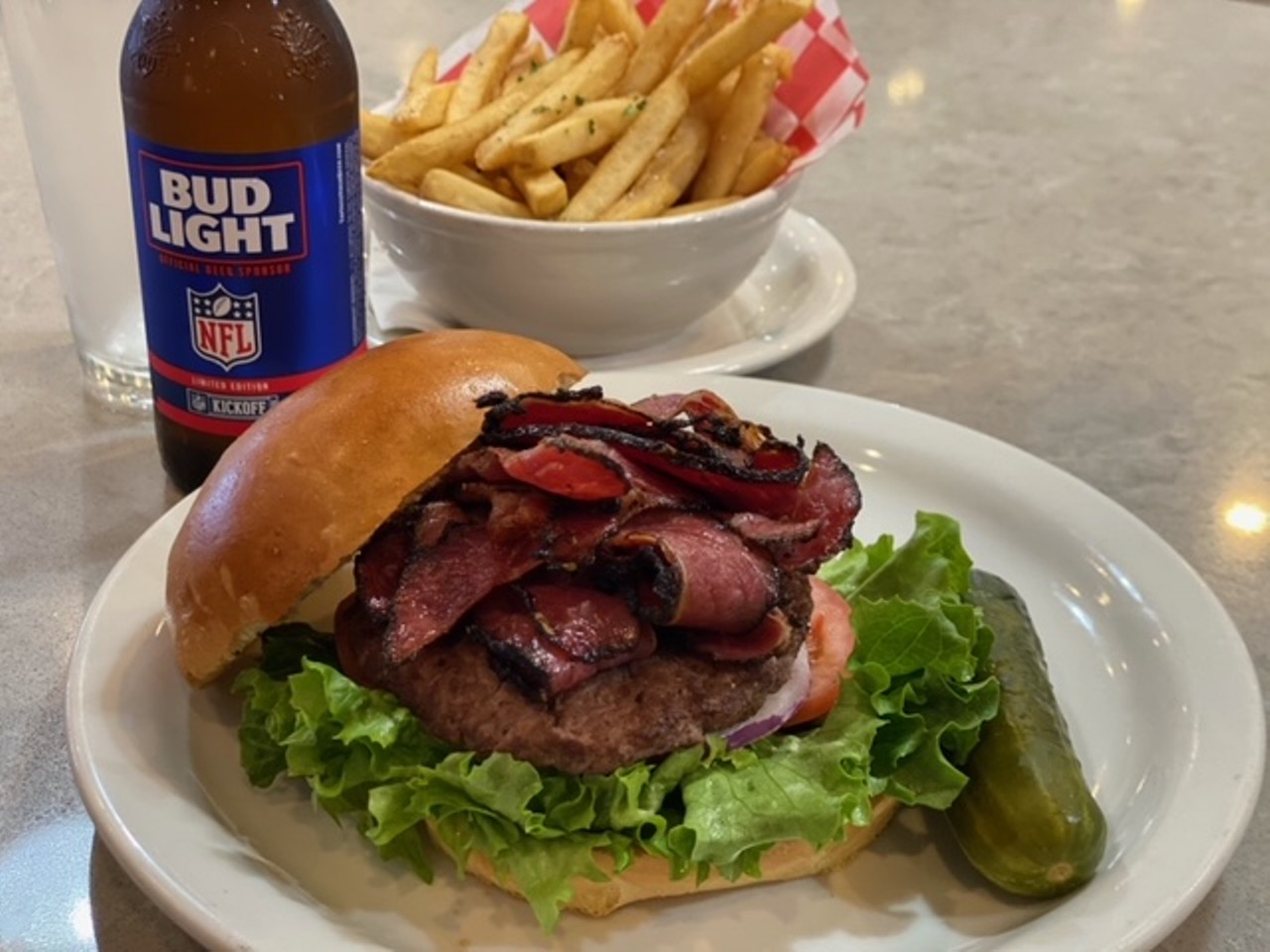 Max & Louie's New York Diner
Dine-In, Curbside and Pick-up, 226 West Bitters Rd., (210) 483-7600, maxandlouiesdiner.comE
New York Deli Burger, $8, 1/4 lb. ground beef topped with sliced pastrami on a house-baked brioche bun. 
Photo courtesy of Max & Louie's New York Diner