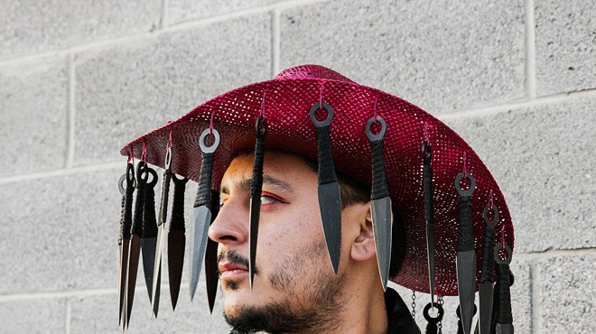 El Paso-based photographer Jeanette Nevarez captured Villalobos in a hat he hopes to use in a future performance.