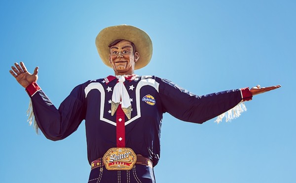 Despite his cowboy duds, the Texas State Fair's towering mascot, Big Tex, doesn't pack a shooting iron on his hip.