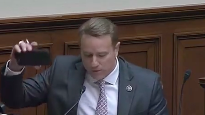 U.S. Rep. Pat Fallon holds up a "dang smartphone" to show why the world is going to hell in a handbasket.
