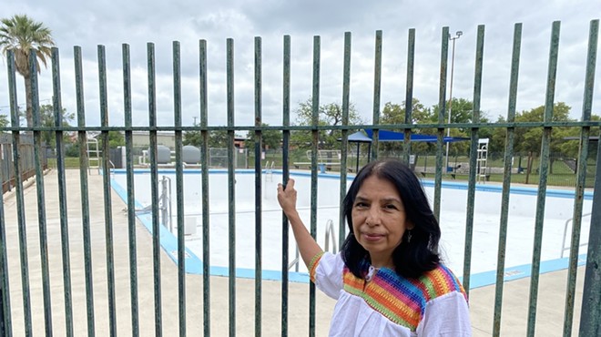 Leticia Sanchez stands by the pool at Cassiano Park, which has been out of commission for the past three summers.