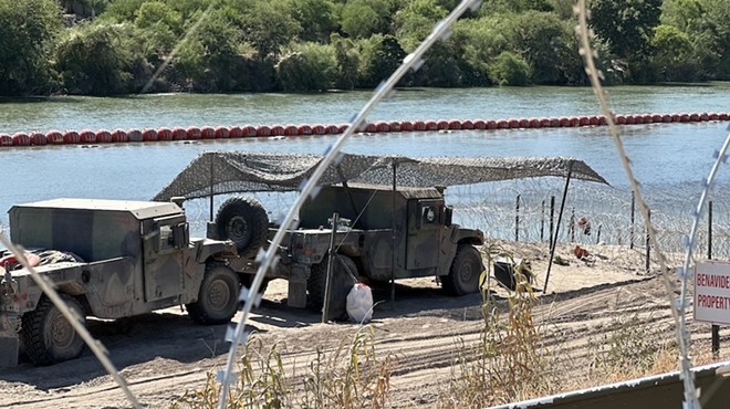 These vehicles along the Rio Grande are part of the state's effort to thwart border crossings.