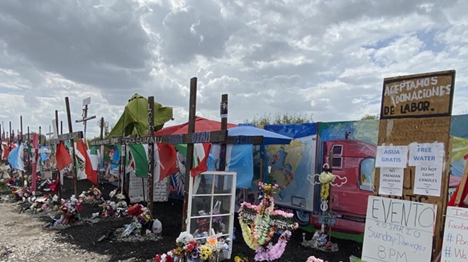 A makeshift memorial has grown up around the site where more than 50 migrants died in the back of a tractor-trailer abandoned in San Antonio.