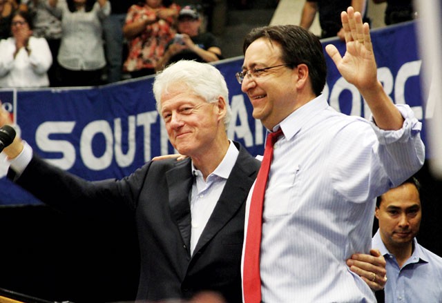 Bill Clinton and Pete Gallego at South San High School. Photobomb by Joaquin Castro. - MICHAEL BARAJAS