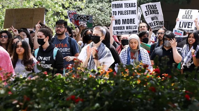Pro-Palestinian protesters calling for a ceasefire in Gaza march through the outdoor corridors of UTSA on Wednesday, April 24, 2024.