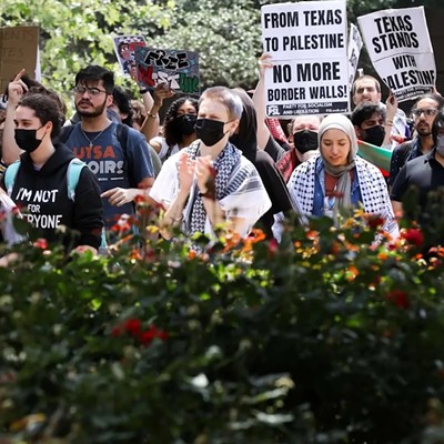 Pro-Palestinian protesters calling for a ceasefire in Gaza march through the outdoor corridors of UTSA on Wednesday, April 24, 2024.
