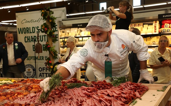 Culinary Development Executive Chef Denis Dello Stritto puts the finishing touches on the record-breaking charcuterie board at Central Market.