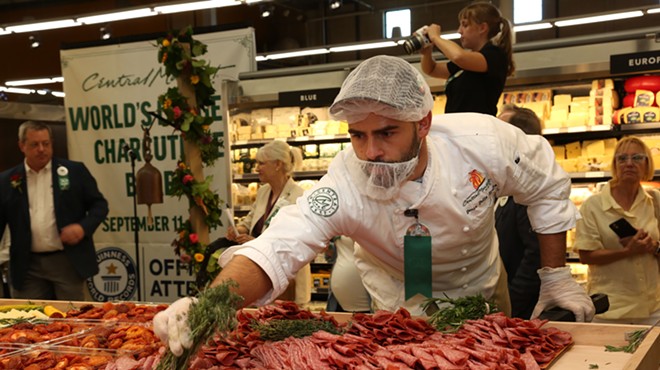 Culinary Development Executive Chef Denis Dello Stritto puts the finishing touches on the record-breaking charcuterie board at Central Market.