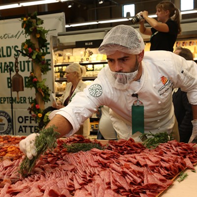 Culinary Development Executive Chef Denis Dello Stritto puts the finishing touches on the record-breaking charcuterie board at Central Market.