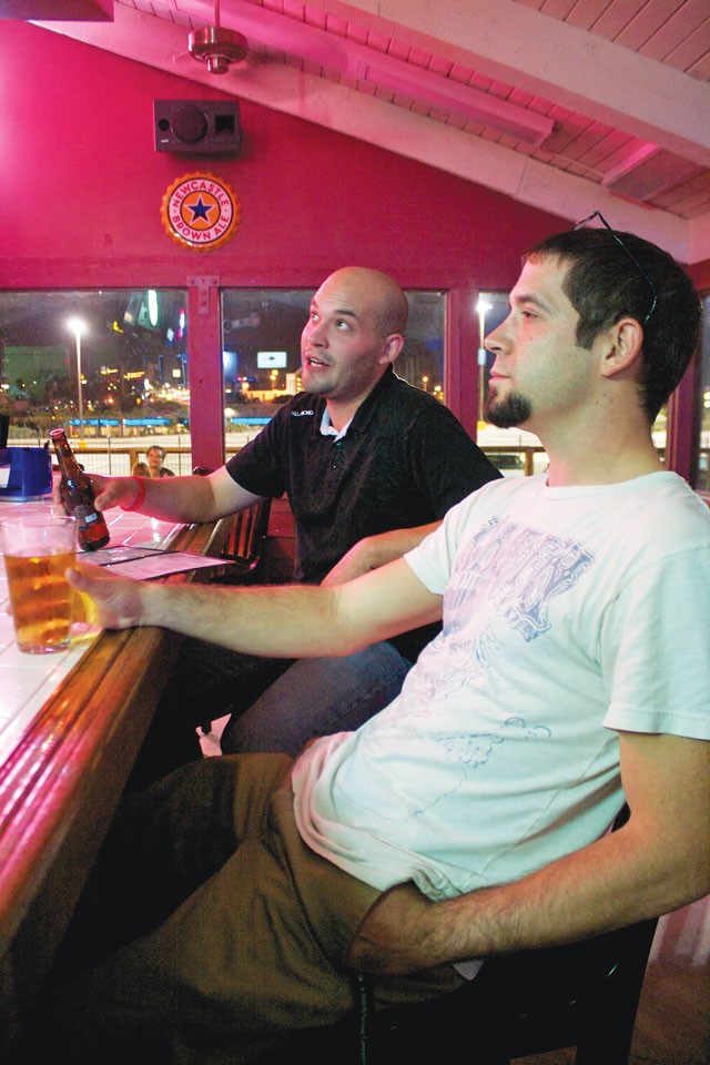 Daniel Arsenault and John Ford have a relaxed brew at Wurzbach Ice House.