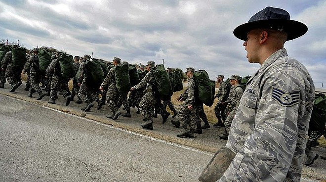 A military training instructor at San Antonio's Lackland Air Force Base marches his flight of recruits.