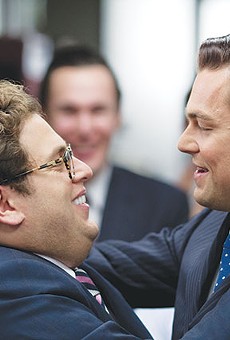 Donnie Azoff (Jonah Hill, left), the first loser turned millionaire by Jordan Belfort (Leonardo DiCaprio) in 'The Wolf of Wall Street'