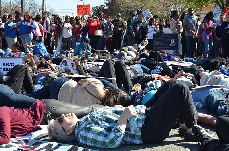 Dozens of activists staged a "die-in" at the city's MLK March. - Albert Salazar