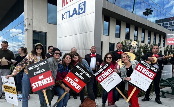 Lindsey Villarreal (right) joins the picket line with other Latines participaing in the Writers Guild of America strike.