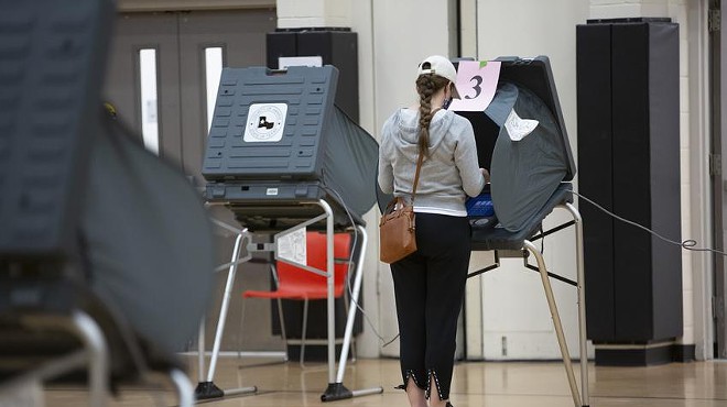 A voter casts her ballot at the Metropolitan Multi-Service Center in Houston on Election Day, Nov. 3, 2020.