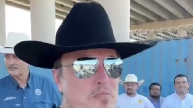 Texas billionaire Elon Musk wears his cowboy hate backwards during a visit to Eagle Pass last year.