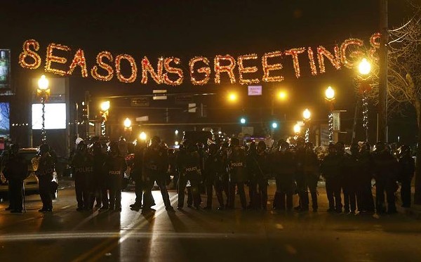 Law enforcement wearing riot gear in Ferguson, MO on Monday, November 24, 2014. Protesters clashed with police following the announcement that a grand jury decided not to indict Officer Darren Wilson for the fatal shooting of Michael Brown.