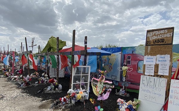 Alamo City residents erected a makeshift memorial at the site where 53 migrants died of heat-related illness in the back of a tractor-trailer in June 2022.