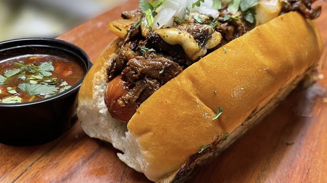 The Dogfather's Birria Dog is topped with beef birria, melted mozzarella, diced onion and cilantro.