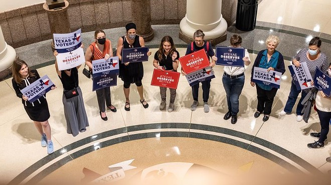 Activists gather outside a Senate committee hearing on proposed election reforms at the Capitol on Saturday, July 10, 2021.