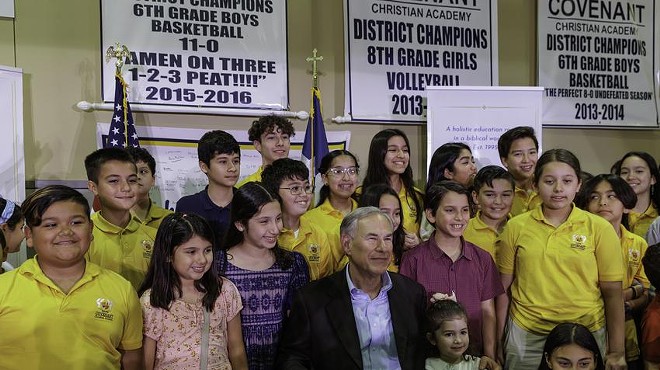 Gov. Greg Abbott poses for a photo with Covenant Christian Academy students at the Parent Empowerment Night event hosted by the Parent Empowerment Coalition in McAllen on April 12, 2023.