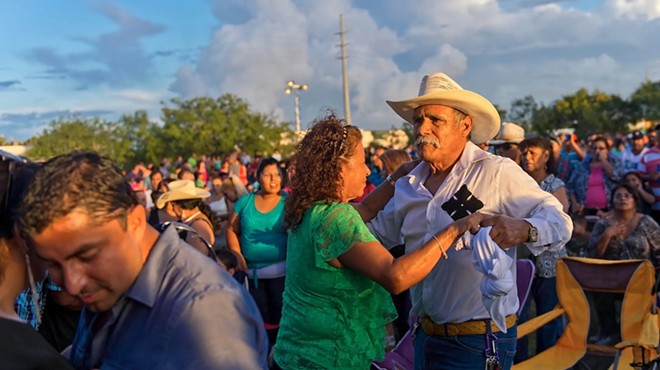 Luisa and Antonio Perez dance to the band Tigrillos at the Festival Viva Mexico in Corpus Christi on Sept. 8, 2013.