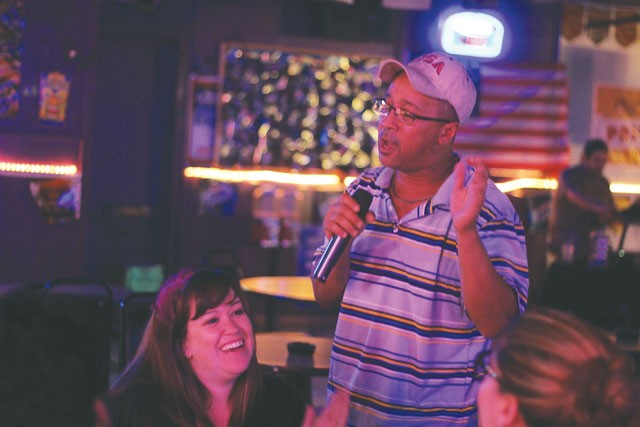 John Burwell sings to Dr. Shaver and the rest of the Scientists at Hidden Tavern. - CHUCK KERR