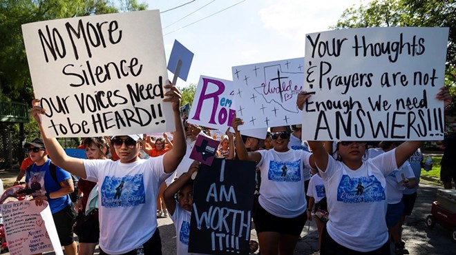 Family members and friends participate in a march on July 10, 2022, in support of those killed and injured in the school shooting at Robb Elementary in Uvalde.