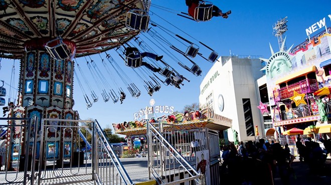 A political battle over a gun ban at the State Fair has escalated with a lawsuit filed by the Attorney General who seeks to overturn the ban.