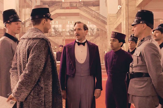 M. Gustave (Ralph Fiennes) and Zero (Tony Revolori) try to charm their way out of one of many sticky situations in The Grand Budapest Hotel - COURTESY PHOTO
