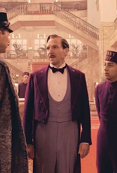 M. Gustave (Ralph Fiennes) and Zero (Tony Revolori) try to charm their way out of one of many sticky situations in The Grand Budapest Hotel