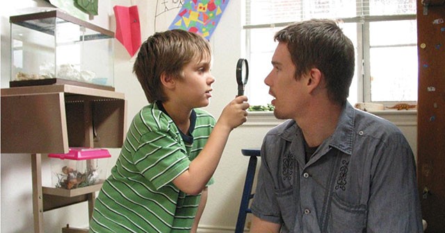 Mason (Ellar Coltrane) investigates his father (Ethan Hawke) in the film Boyhood - Courtesy photo