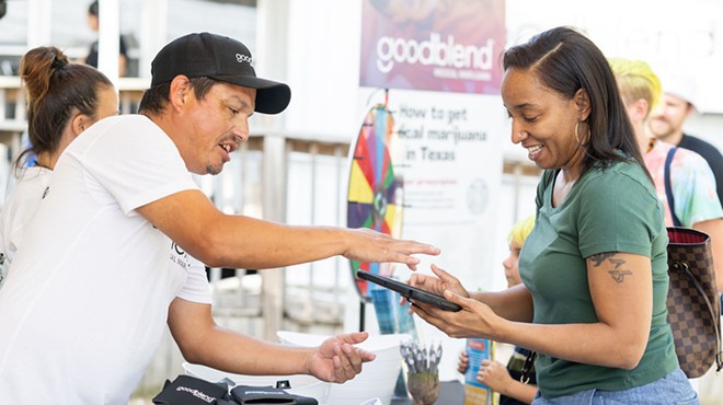 A goodblend employee works with a prospective patient at a promotional event in Austin.