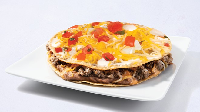 Taco Cabana's take on the Mexican Pizza features cheese, beef, beans and dressing between two fried tortillas.