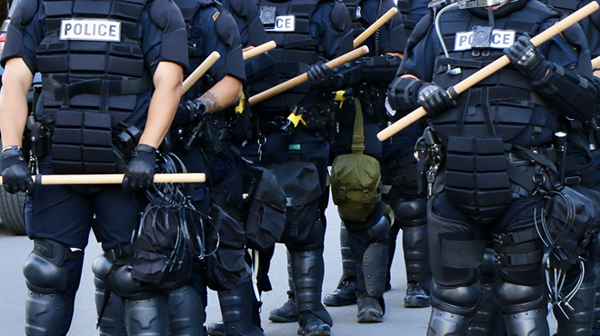 San Antonio Police in riot gear stand at the ready during the George Floyd protests in San Antonio in 2020.