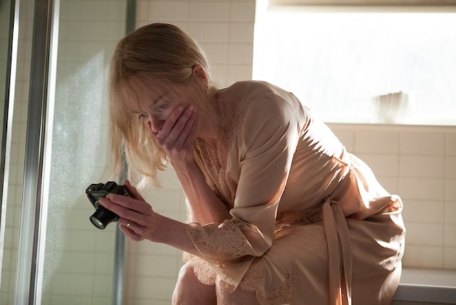Troubled amnesiac Christine Lucas (Nicole Kidman) reviews her own video diary in 'Before I Go to Sleep.' - COURTESY